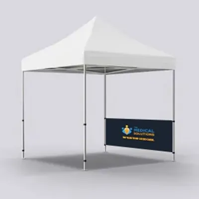 A white promotional event tent, with a custom branded banner reading 'MEDICAL SOLUTIONS - WWW.MEDICAL.COM' at a trade show display.